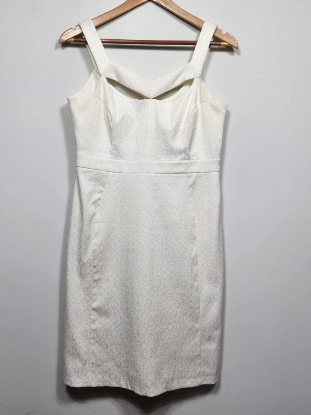 A white Merve Antoniopoulo brand tight-fitting dress